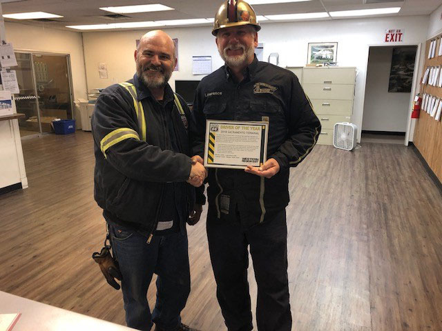 A photo of Ramos Oil Company Fuel Driver Lawrence Lake being awarded the 2018 Sacramento Phillips 66 Driver of the year award from Sacramento Terminal Operator David Colgrove