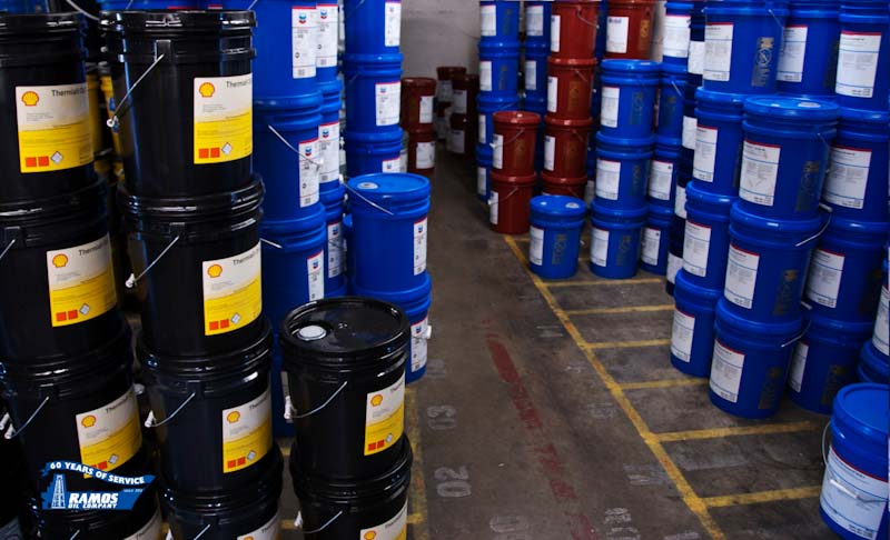 A Photo of stacked 5 gallon buckets of discounted petroleum products available at Ramos Oil Company