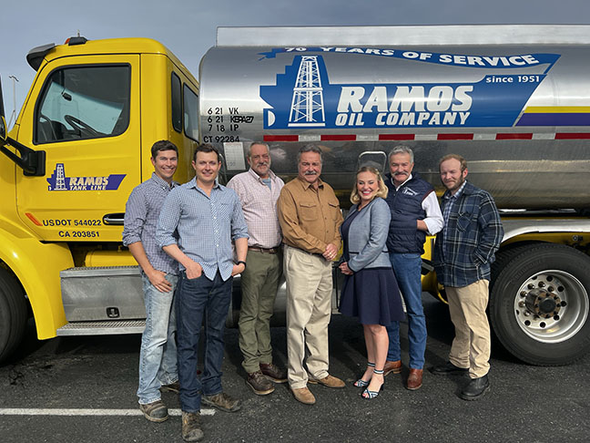 ramos-oil-family in-front of a Ramos oil truck