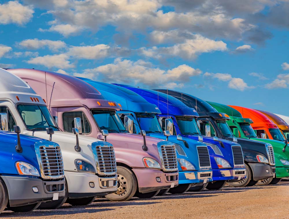 Semi trucks in many colors are lined up in Texas (P)